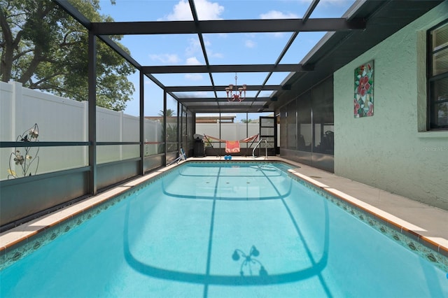7022 Kingsway Dr, Port Richey, FL 34668 - view of pool featuring a fenced backyard and glass enclosure