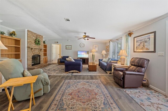 2221 W Lake Dr, Wimauma, FL 33598 - living area featuring a ceiling fan, wood finished floors, a fireplace, crown molding, and vaulted ceiling
