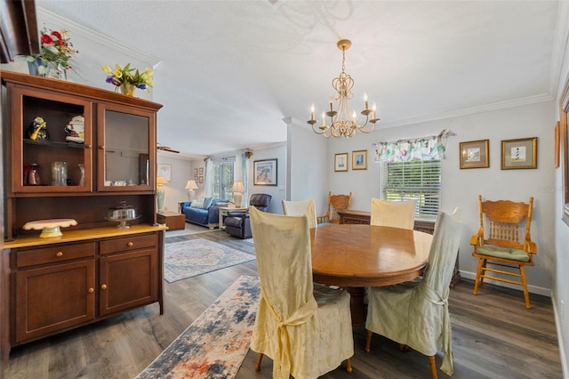 2221 W Lake Dr, Wimauma, FL 33598 - dining space featuring crown molding, a chandelier, and dark wood-type flooring