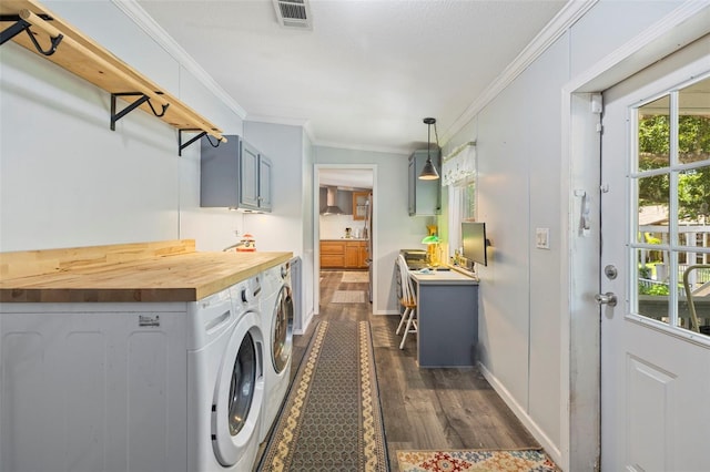 2221 W Lake Dr, Wimauma, FL 33598 - laundry room with separate washer and dryer, dark wood finished floors, and ornamental molding
