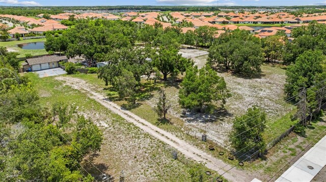 2221 W Lake Dr, Wimauma, FL 33598 - aerial perspective of suburban area with a nearby body of water
