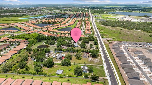 2221 W Lake Dr, Wimauma, FL 33598 - aerial overview of property's location with a nearby body of water and nearby suburban area