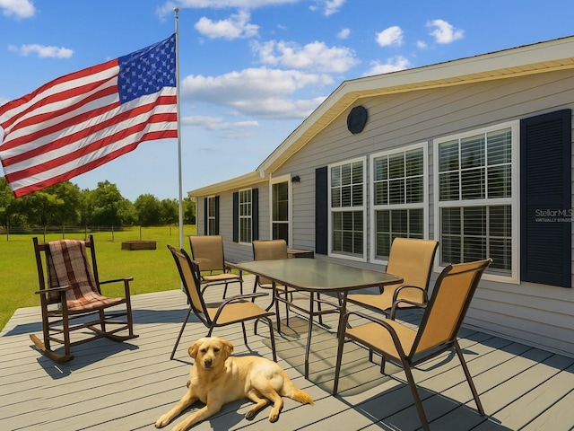 2221 W Lake Dr, Wimauma, FL 33598 - wooden deck with outdoor dining area and a yard