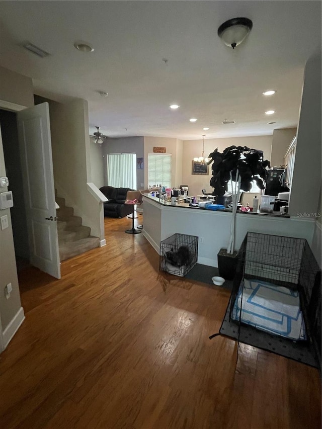 8405 Costa Bella Way, Temple Terrace, FL 33637 - kitchen featuring wood finished floors, a chandelier, and recessed lighting