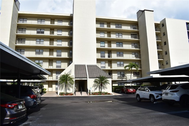3200 Cove Cay Dr Unit 5F, Clearwater, FL 33760 - view of apartment building / complex with covered parking