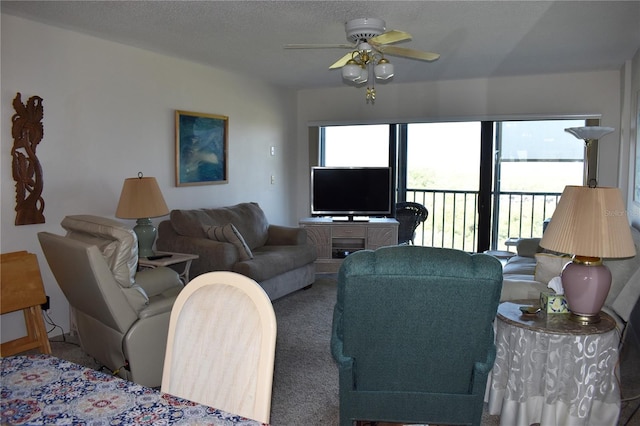 3200 Cove Cay Dr Unit 5F, Clearwater, FL 33760 - carpeted living area featuring ceiling fan