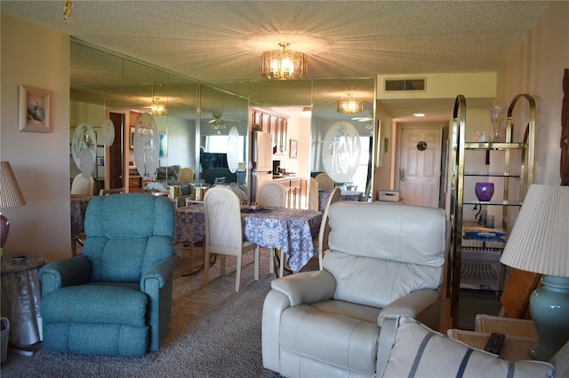 3200 Cove Cay Dr Unit 5F, Clearwater, FL 33760 - carpeted living area with a ceiling fan, a textured ceiling, and a chandelier
