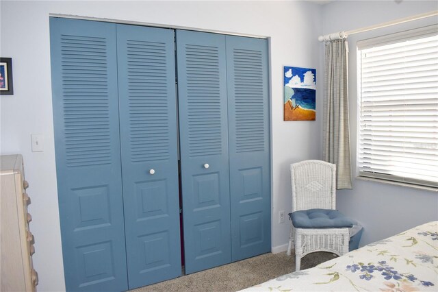 3200 Cove Cay Dr Unit 5F, Clearwater, FL 33760 - carpeted bedroom with a closet and baseboards