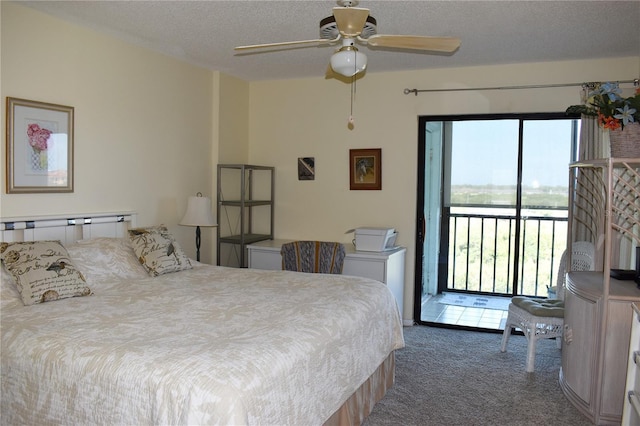3200 Cove Cay Dr Unit 5F, Clearwater, FL 33760 - bedroom with access to outside, carpet, and a textured ceiling