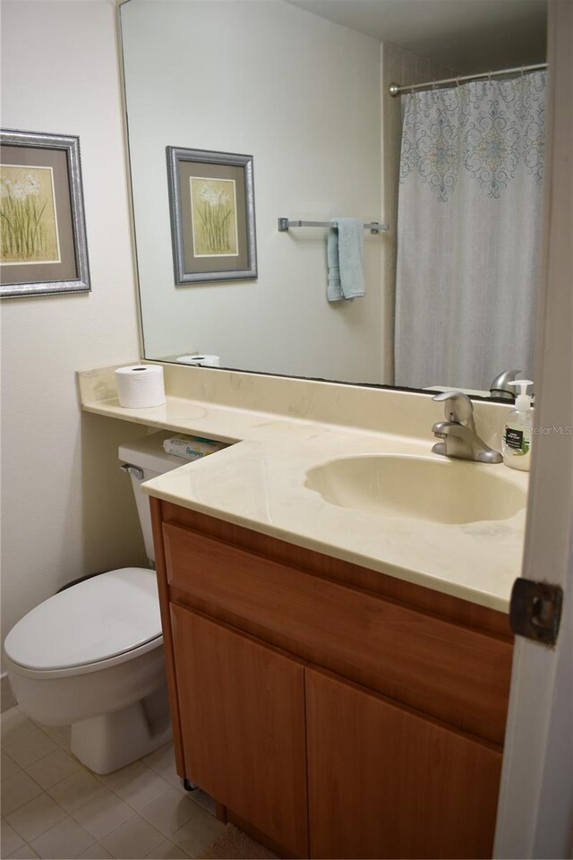 3200 Cove Cay Dr Unit 5F, Clearwater, FL 33760 - bathroom featuring tile patterned flooring, vanity, and a shower with curtain