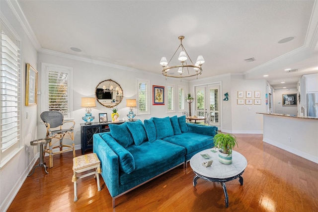 1731 W Watrous Ave Unit 202, Tampa, FL 33606 - living area with a chandelier, crown molding, wood finished floors, and french doors