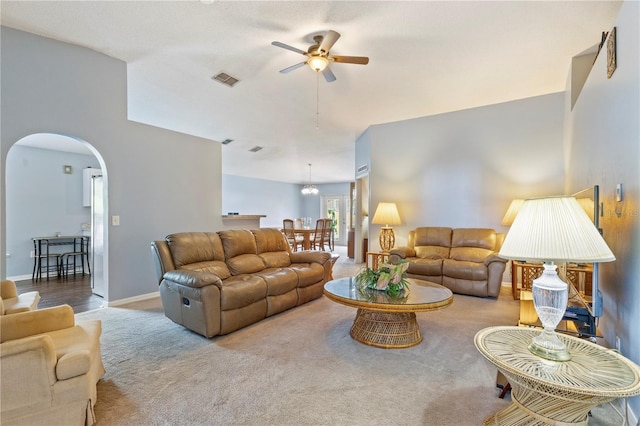 7804 Country Chase Ave, Lakeland, FL 33810 - living room featuring a ceiling fan, arched walkways, and carpet floors