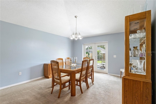 7804 Country Chase Ave, Lakeland, FL 33810 - dining area with light colored carpet, a chandelier, french doors, and a textured ceiling