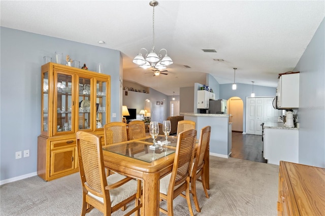 7804 Country Chase Ave, Lakeland, FL 33810 - dining area featuring light carpet, lofted ceiling, a chandelier, and a ceiling fan