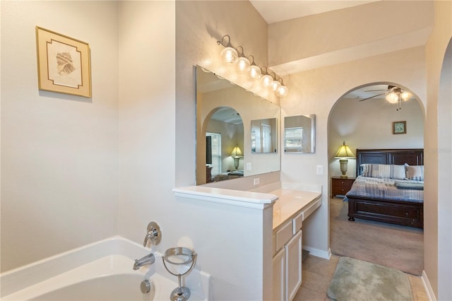 7804 Country Chase Ave, Lakeland, FL 33810 - bathroom featuring connected bathroom, a bath, vanity, a ceiling fan, and tile patterned flooring