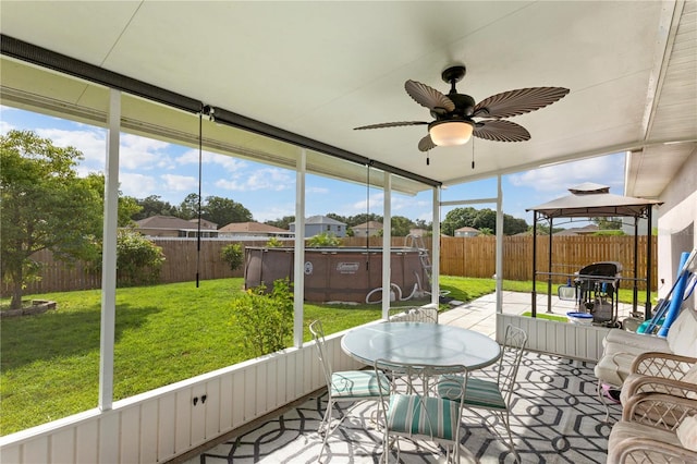 7804 Country Chase Ave, Lakeland, FL 33810 - sunroom / solarium featuring ceiling fan, healthy amount of natural light, and outdoor dining area
