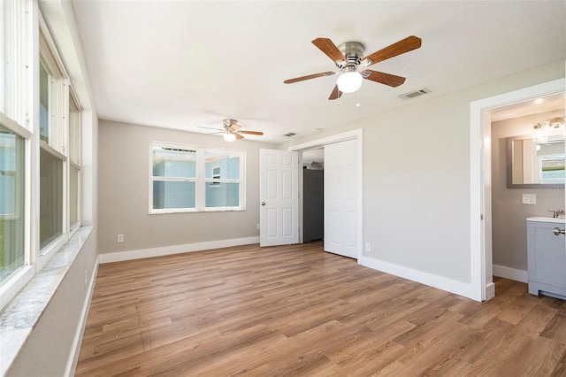 3509 Brookston Dr, Holiday, FL 34691 - unfurnished bedroom featuring light wood-type flooring, ceiling fan, and a closet