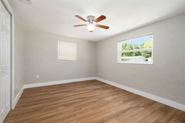 3509 Brookston Dr, Holiday, FL 34691 - unfurnished bedroom featuring a closet, light wood finished floors, and ceiling fan
