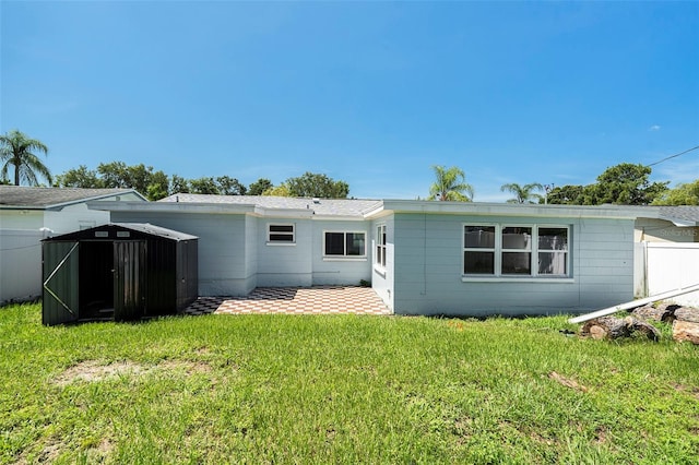3509 Brookston Dr, Holiday, FL 34691 - back of house with a storage shed and a patio area