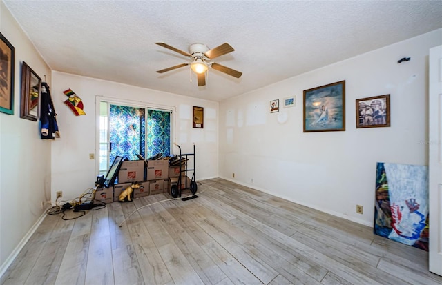 5265 E Bay Dr Unit 521, Clearwater, FL 33764 - spare room with ceiling fan, light wood finished floors, and a textured ceiling