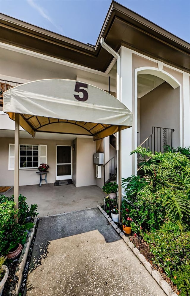 5265 E Bay Dr Unit 521, Clearwater, FL 33764 - property entrance featuring stucco siding