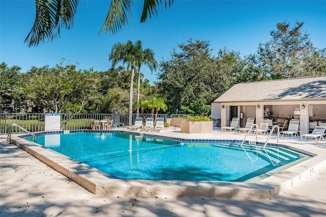 5265 E Bay Dr Unit 521, Clearwater, FL 33764 - community pool with a patio area and view of wooded area