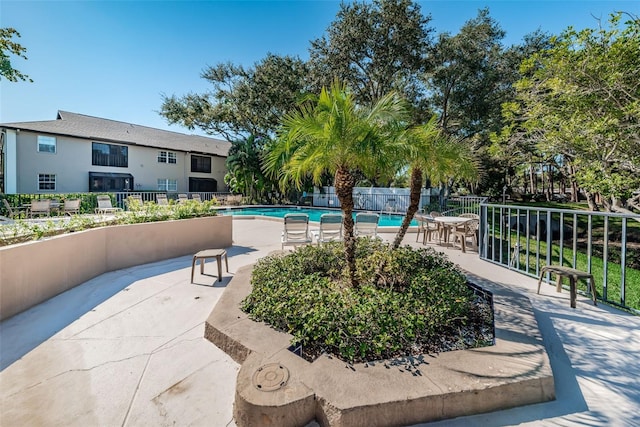 5265 E Bay Dr Unit 521, Clearwater, FL 33764 - community pool featuring a patio
