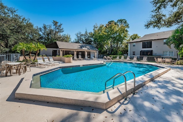 5265 E Bay Dr Unit 521, Clearwater, FL 33764 - community pool with a patio and an outdoor structure