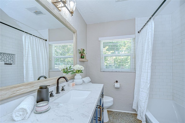 2201 Horan Way S, Gulfport, FL 33707 - full bathroom featuring vanity, shower / bath combination with curtain, and a textured ceiling