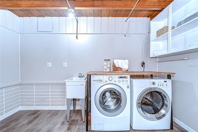2201 Horan Way S, Gulfport, FL 33707 - washroom featuring washer and clothes dryer, wood ceiling, and wood finished floors