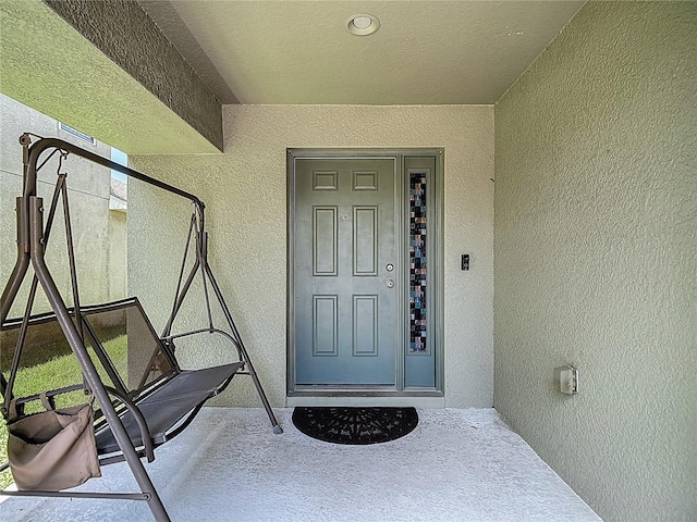 12121 Tree Haven Ave, Gibsonton, FL 33534 - doorway to property featuring stucco siding