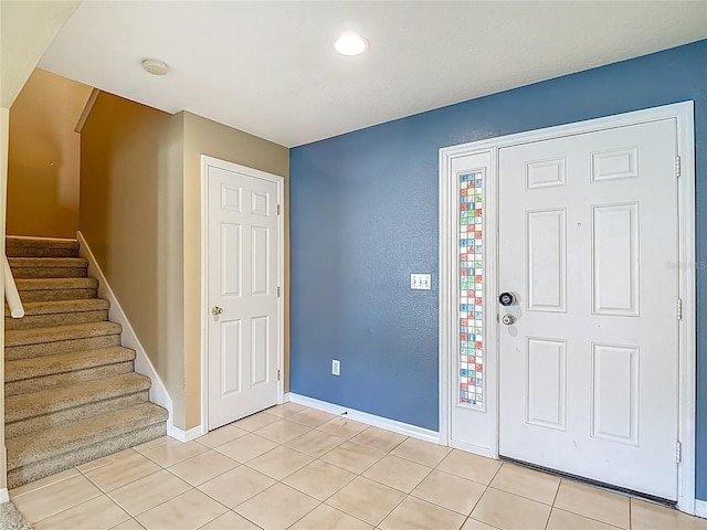 12121 Tree Haven Ave, Gibsonton, FL 33534 - entryway with light tile patterned floors, stairway, arched walkways, and recessed lighting