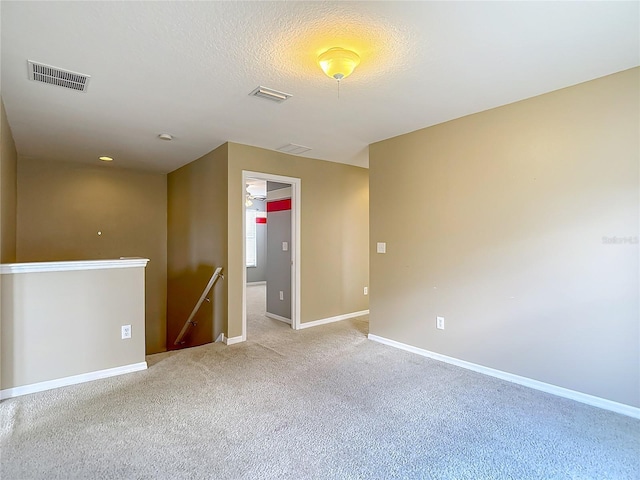 12121 Tree Haven Ave, Gibsonton, FL 33534 - empty room featuring light colored carpet and a textured ceiling