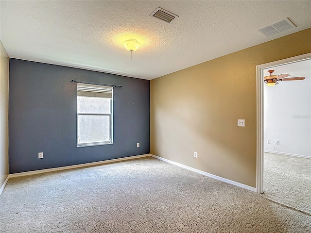 12121 Tree Haven Ave, Gibsonton, FL 33534 - spare room featuring carpet and a textured ceiling