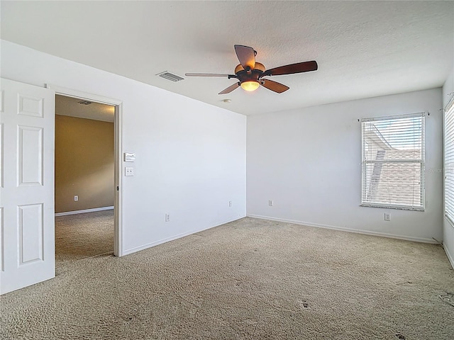 12121 Tree Haven Ave, Gibsonton, FL 33534 - carpeted spare room with a ceiling fan and a textured ceiling