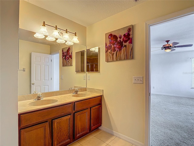 12121 Tree Haven Ave, Gibsonton, FL 33534 - full bathroom featuring double vanity, a ceiling fan, a textured ceiling, and tile patterned floors
