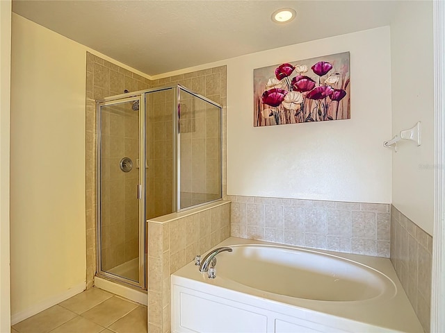 12121 Tree Haven Ave, Gibsonton, FL 33534 - bathroom with a garden tub, a stall shower, tile patterned floors, and recessed lighting