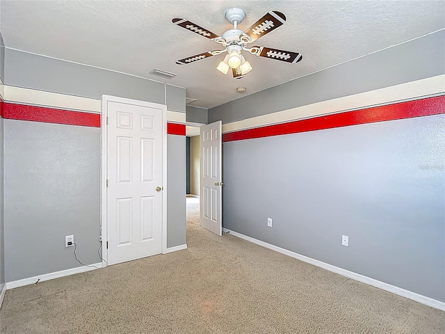 12121 Tree Haven Ave, Gibsonton, FL 33534 - unfurnished bedroom featuring a textured ceiling, carpet, and ceiling fan