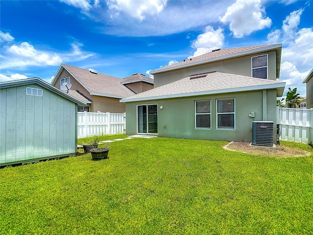 12121 Tree Haven Ave, Gibsonton, FL 33534 - rear view of property featuring stucco siding, a shingled roof, and a storage shed