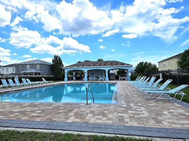 12121 Tree Haven Ave, Gibsonton, FL 33534 - community pool featuring a patio