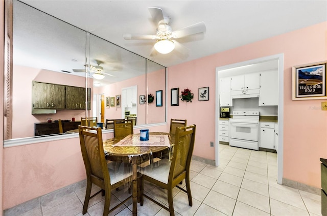 2700 Bayshore Blvd Unit 1206, Dunedin, FL 34698 - dining room with a ceiling fan and light tile patterned flooring