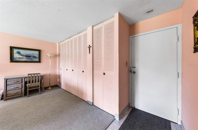 2700 Bayshore Blvd Unit 1206, Dunedin, FL 34698 - unfurnished bedroom with a textured ceiling and carpet flooring