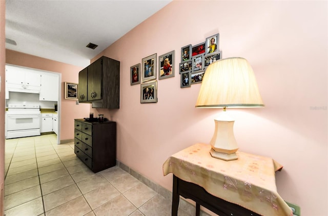 2700 Bayshore Blvd Unit 1206, Dunedin, FL 34698 - corridor with light tile patterned flooring