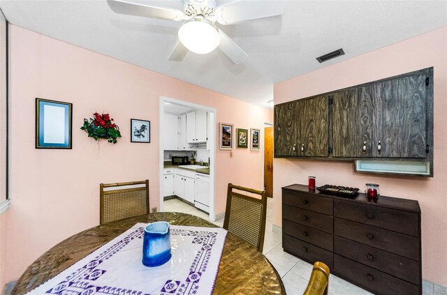 2700 Bayshore Blvd Unit 1206, Dunedin, FL 34698 - dining area featuring a ceiling fan and light tile patterned floors