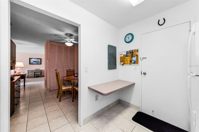 2700 Bayshore Blvd Unit 1206, Dunedin, FL 34698 - corridor with electric panel and light tile patterned floors