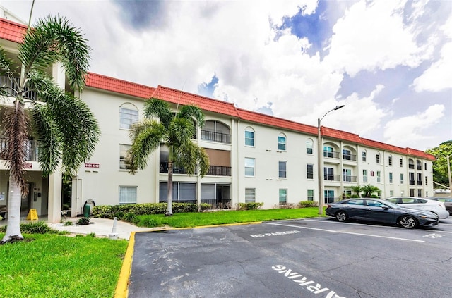 2700 Bayshore Blvd Unit 1206, Dunedin, FL 34698 - view of building exterior featuring uncovered parking