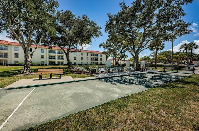 2700 Bayshore Blvd Unit 1206, Dunedin, FL 34698 - view of property's community featuring a game area, a lawn, and a residential view