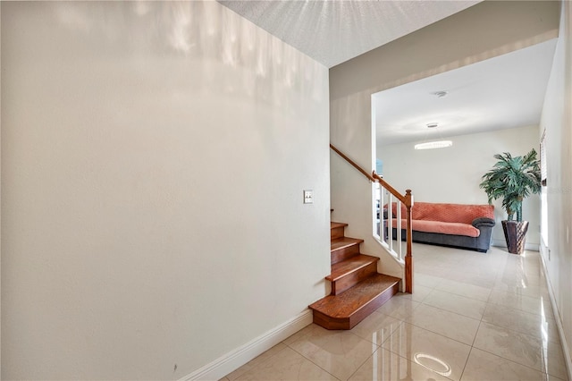 7819 Carriage Pointe Dr, Gibsonton, FL 33534 - stairway with baseboards and tile patterned floors