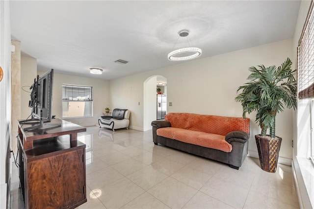 7819 Carriage Pointe Dr, Gibsonton, FL 33534 - living area featuring arched walkways and light tile patterned floors