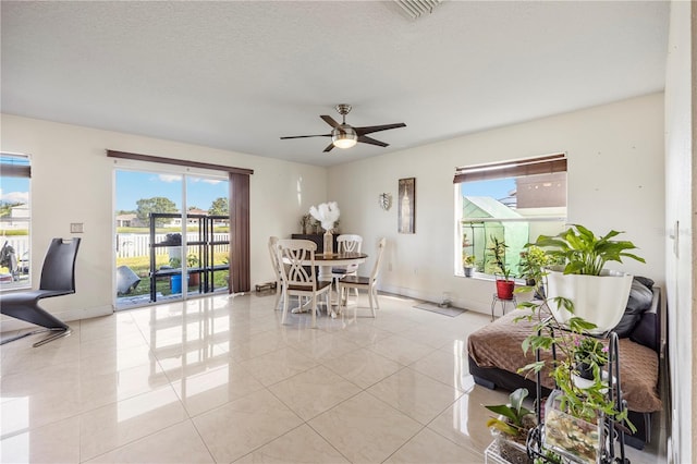7819 Carriage Pointe Dr, Gibsonton, FL 33534 - dining area with plenty of natural light, a ceiling fan, and light tile patterned floors